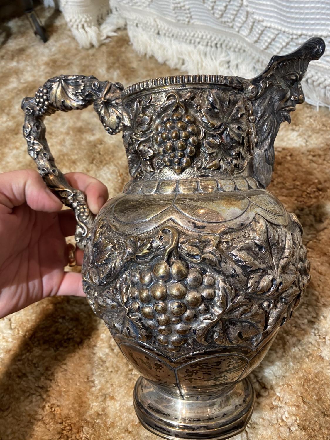 Elaborate Antique Sterling silver pitcher - 1,220 grams.