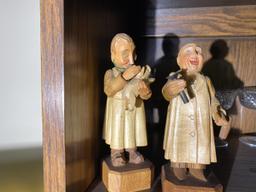 Pair of whimsical carved occupational figures