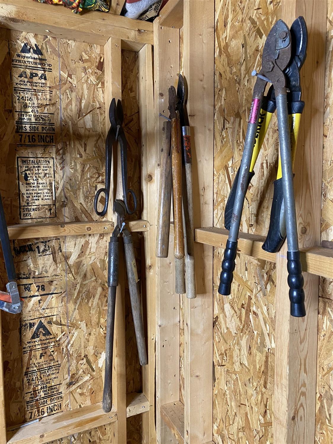 Assorted tools hanging on wall