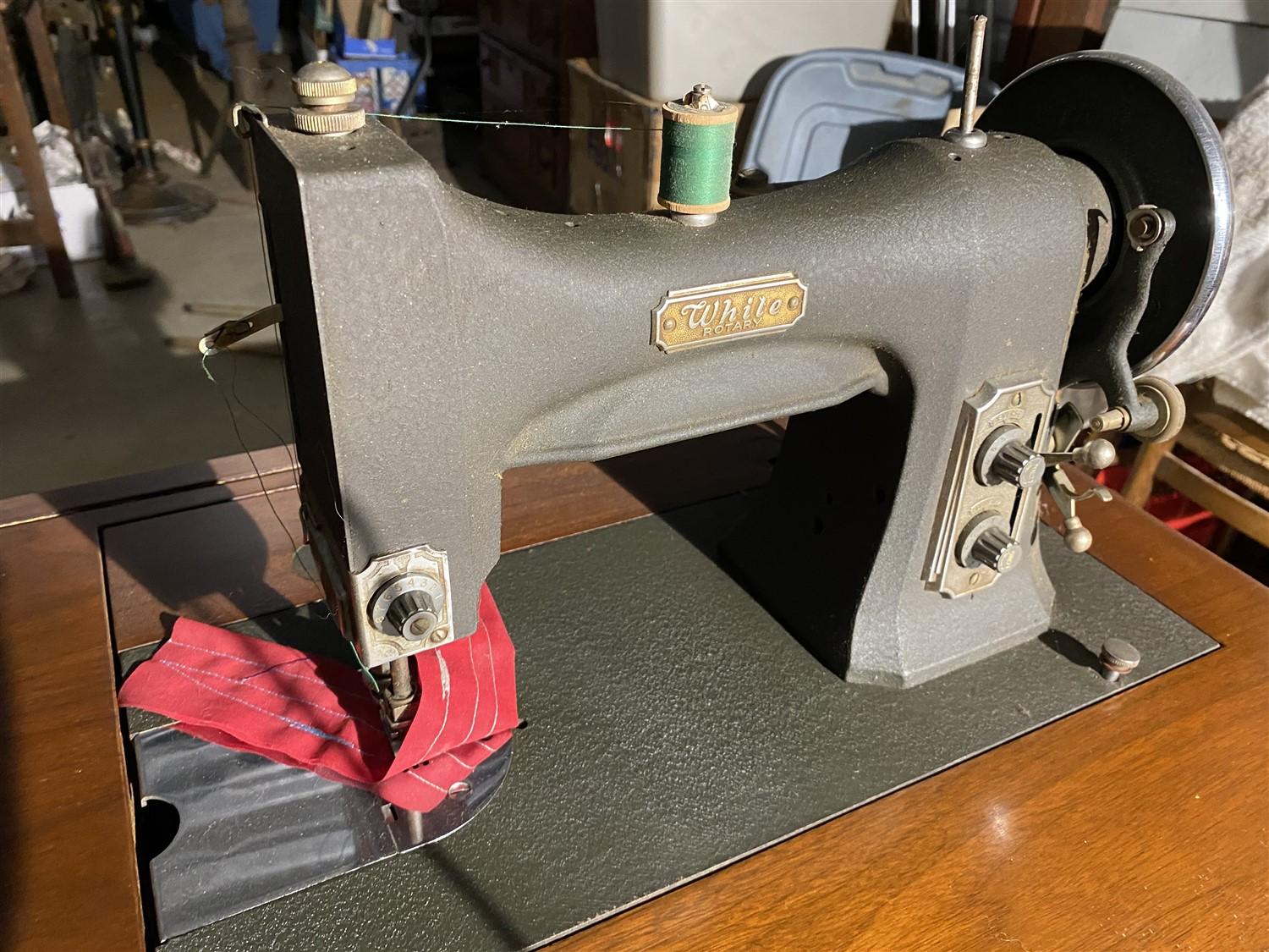 Vintage sewing machine in cabinet