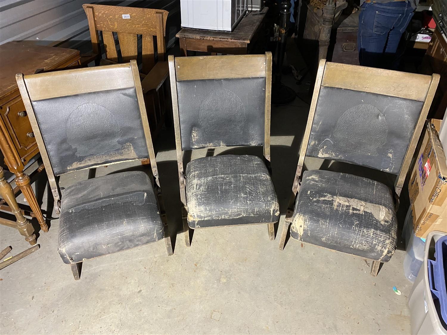 Group of three antique folding theater seats