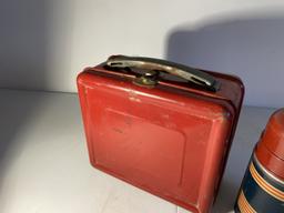 Vintage red metal lunchbox and thermos