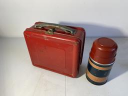 Vintage red metal lunchbox and thermos