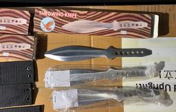 Group lot of throwing knives in boxes