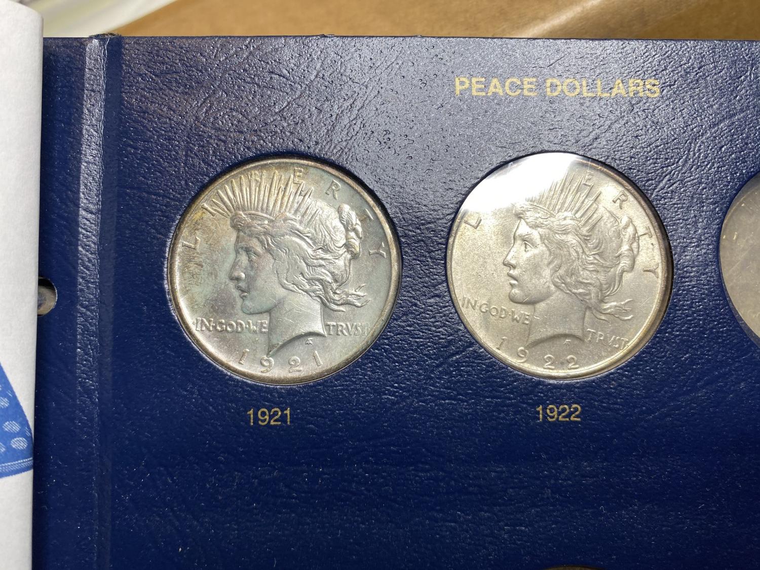 8 Peace Silver DOllar Coins in Album