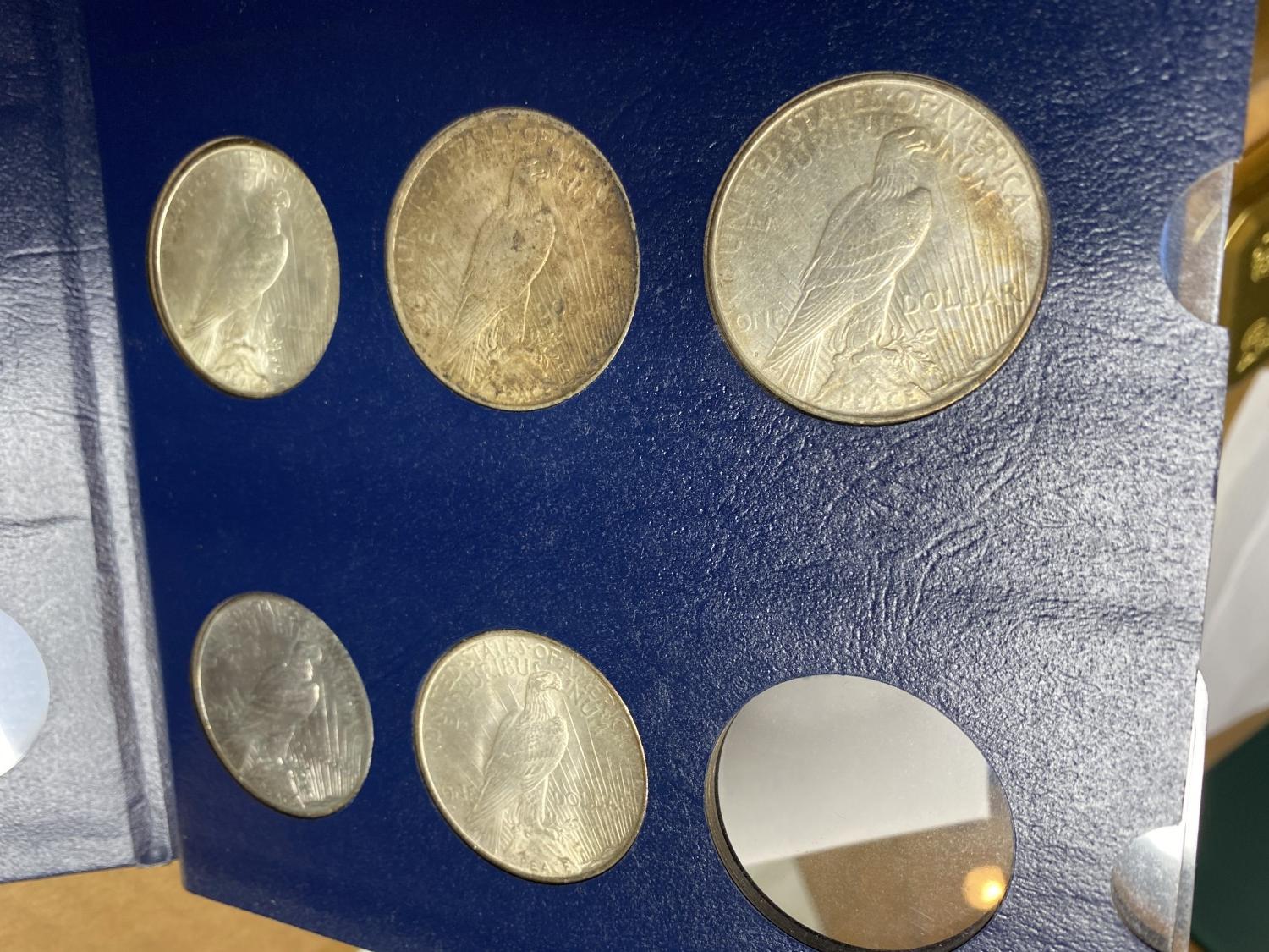 8 Peace Silver DOllar Coins in Album