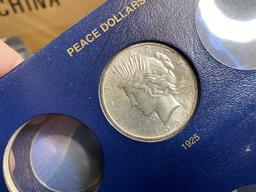 8 Peace Silver DOllar Coins in Album