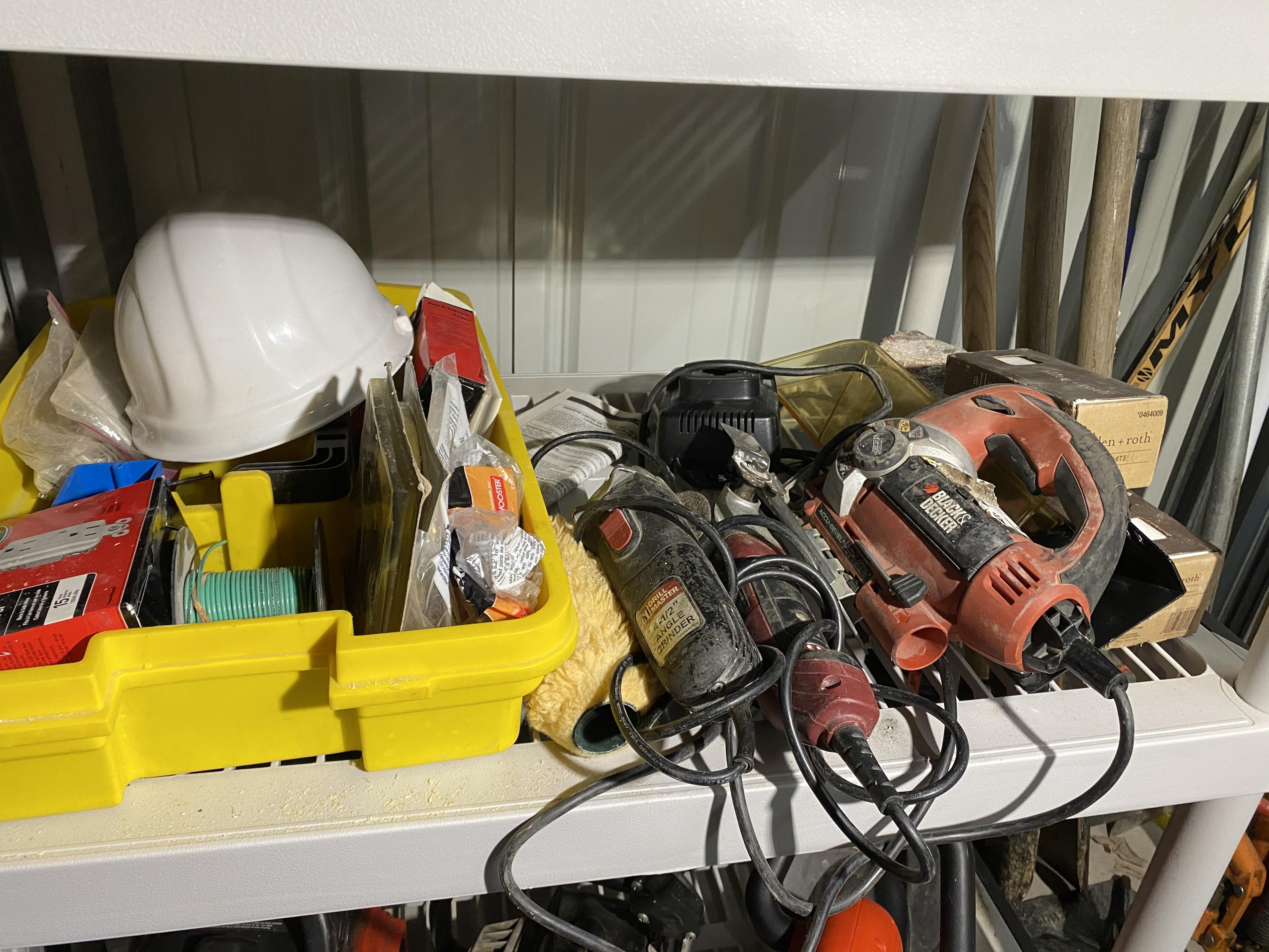 Two shelves of assorted tools and more