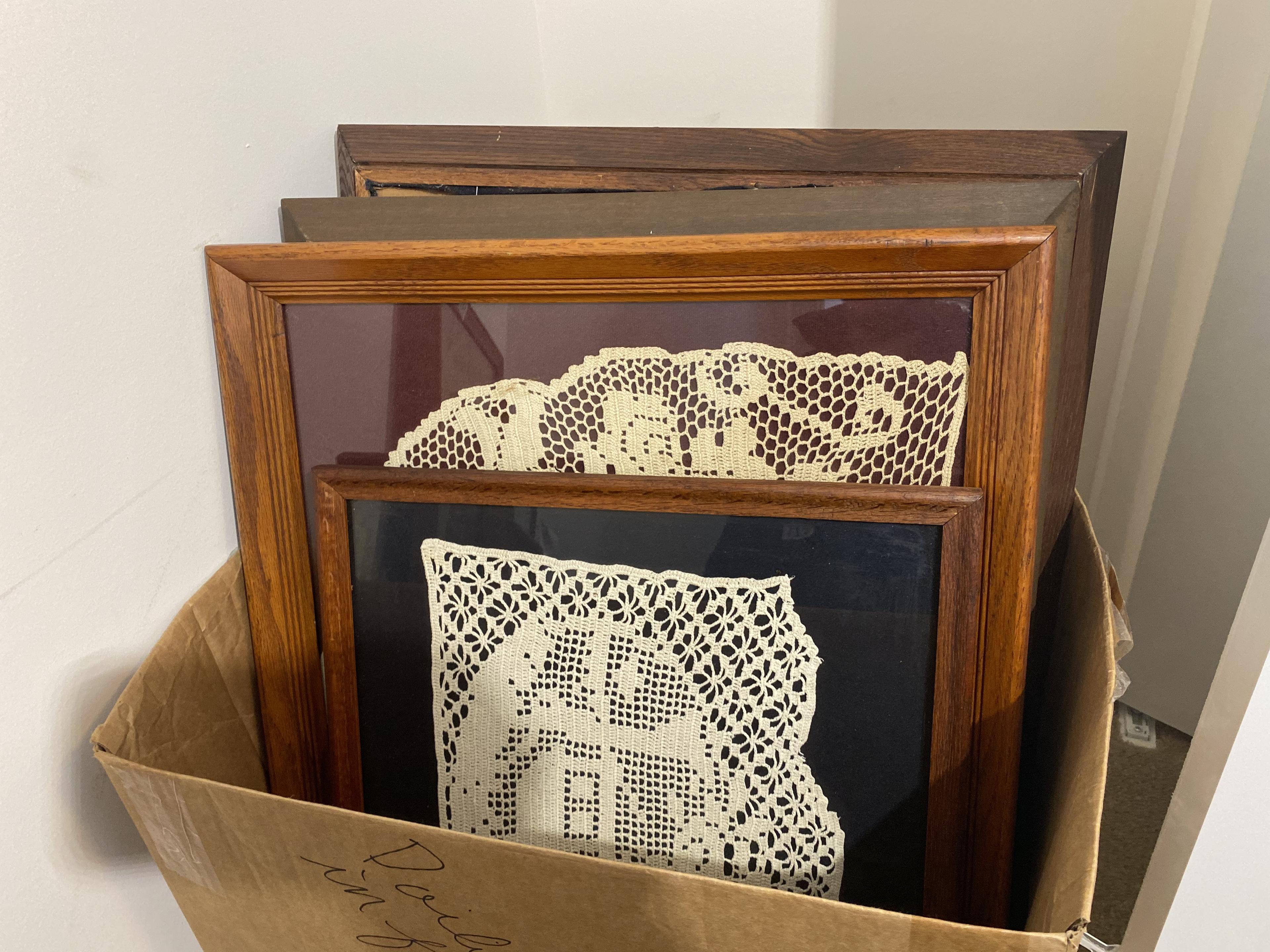 Box of framed Doilies