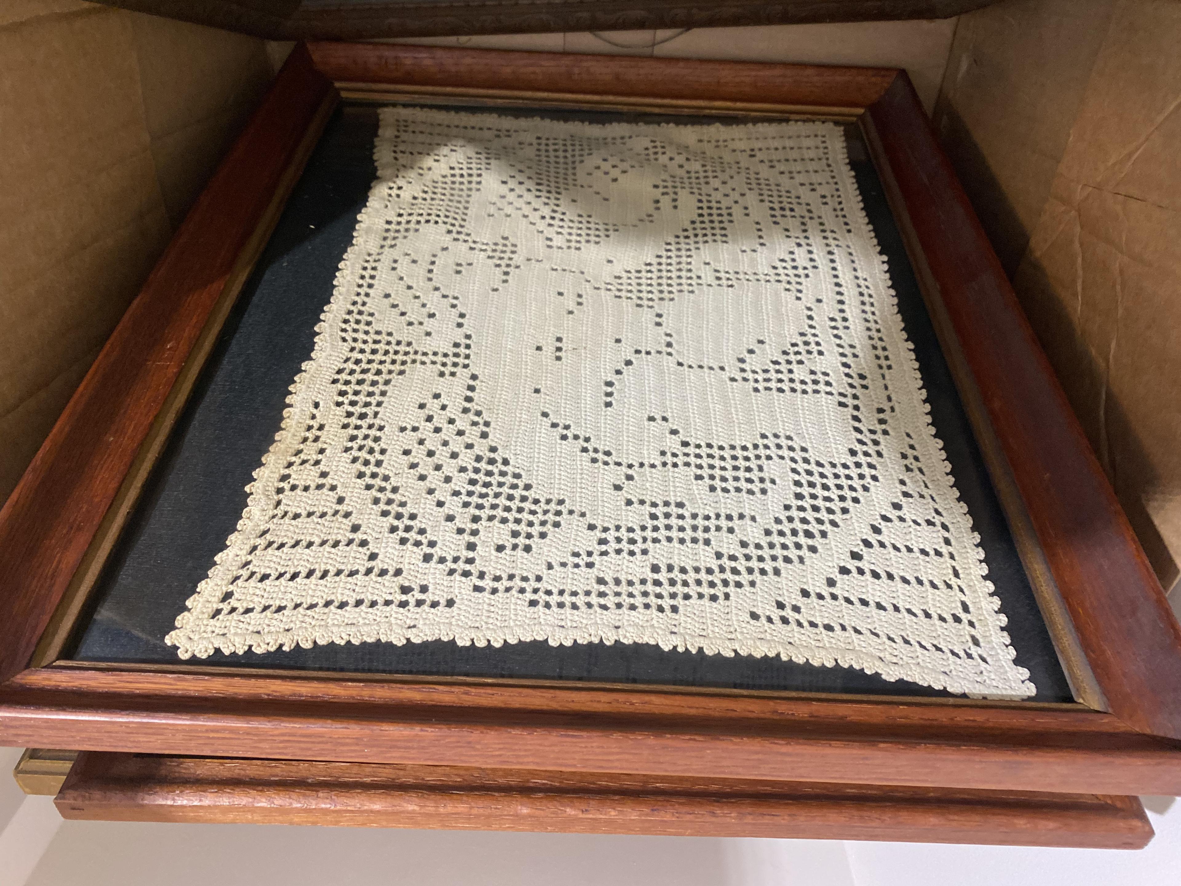 Box of framed Doilies