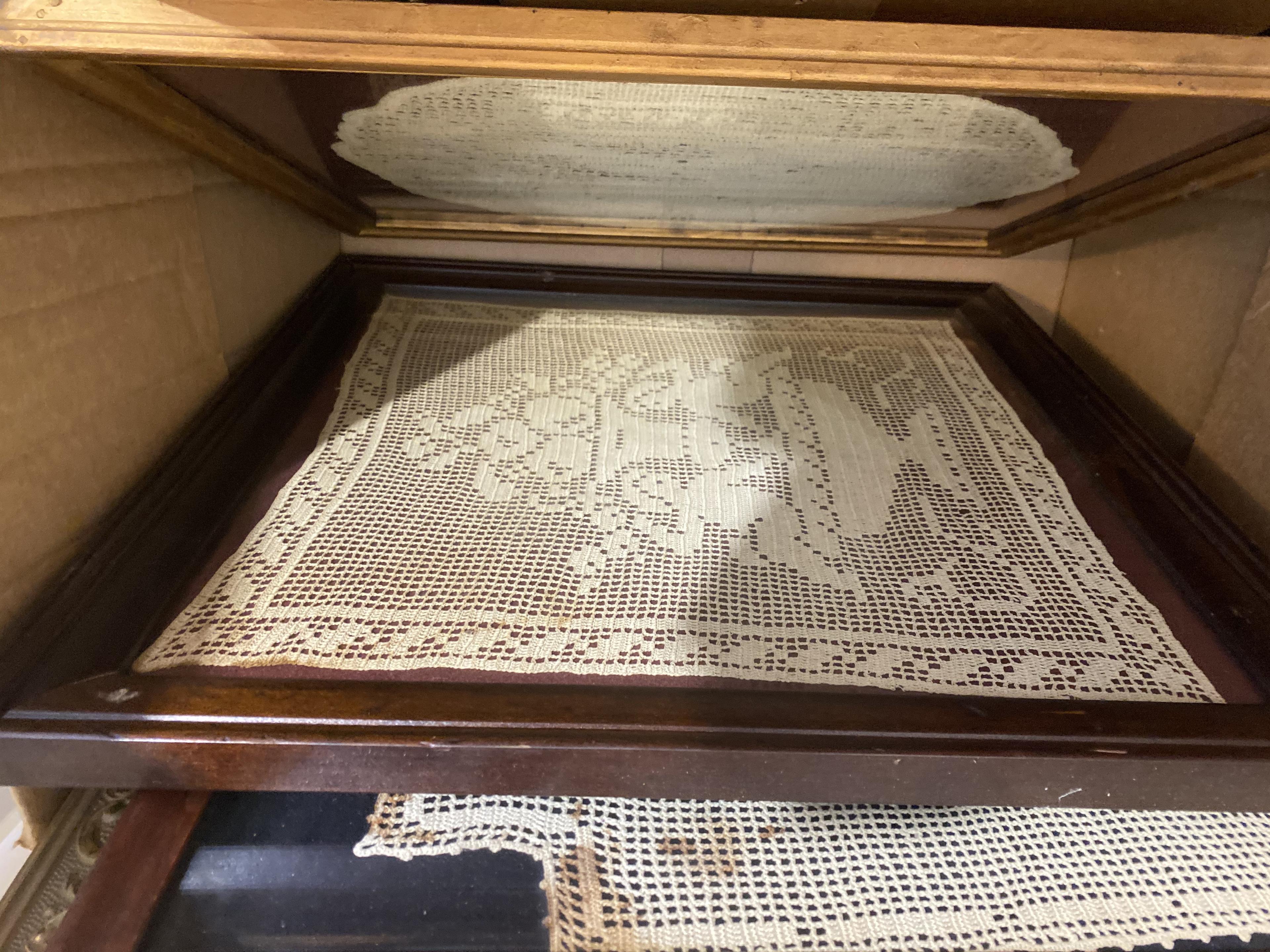 Box of framed Doilies