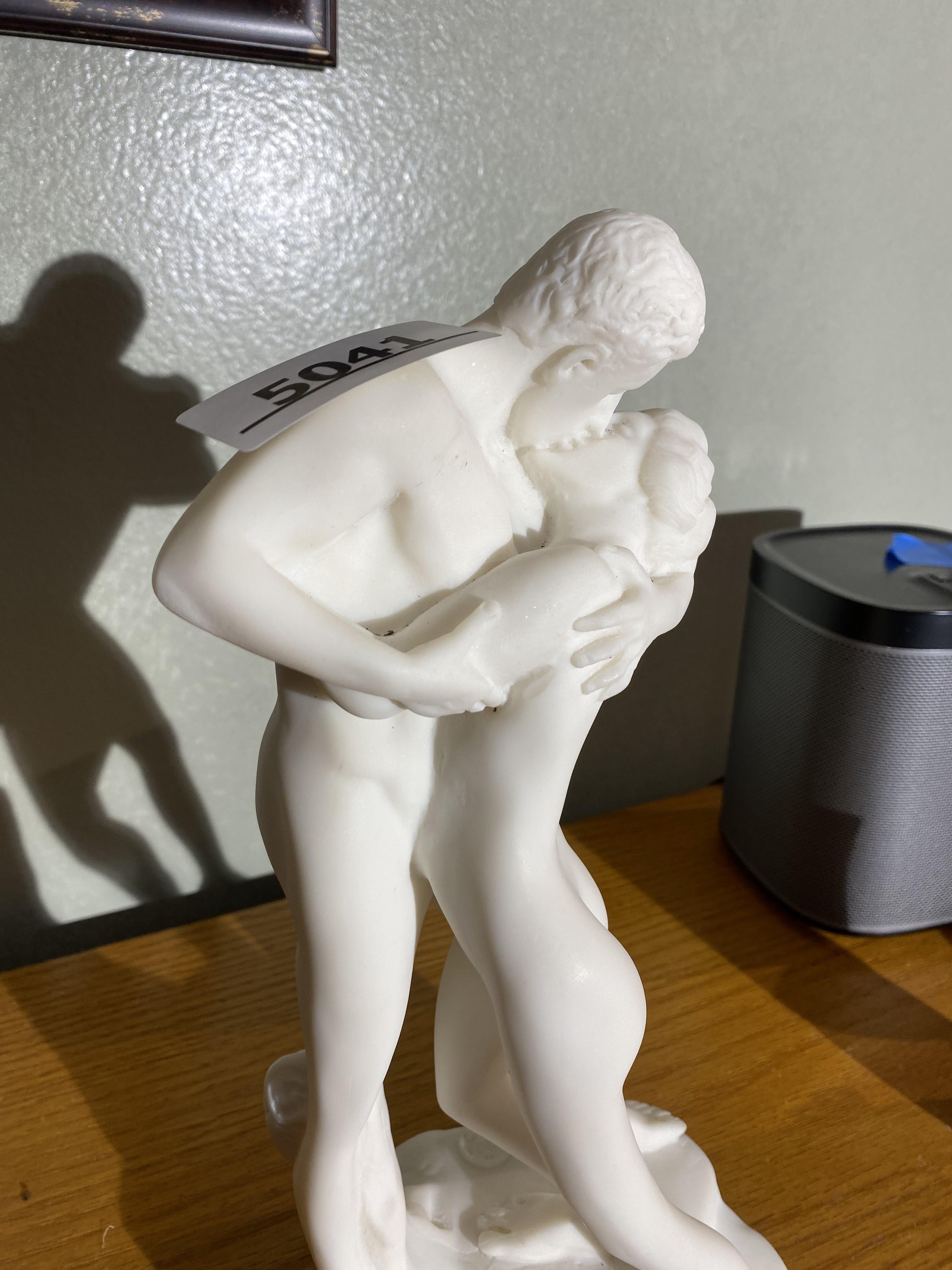 Alabaster sculpture or statue of man and woman kissing