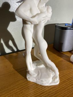 Alabaster sculpture or statue of man and woman kissing