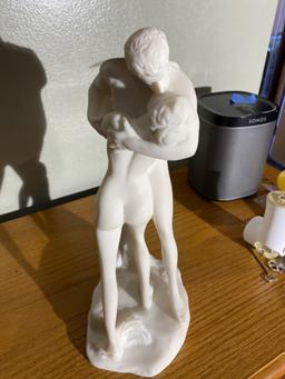 Alabaster sculpture or statue of man and woman kissing