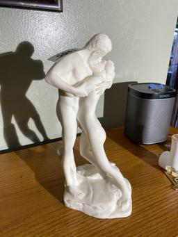 Alabaster sculpture or statue of man and woman kissing