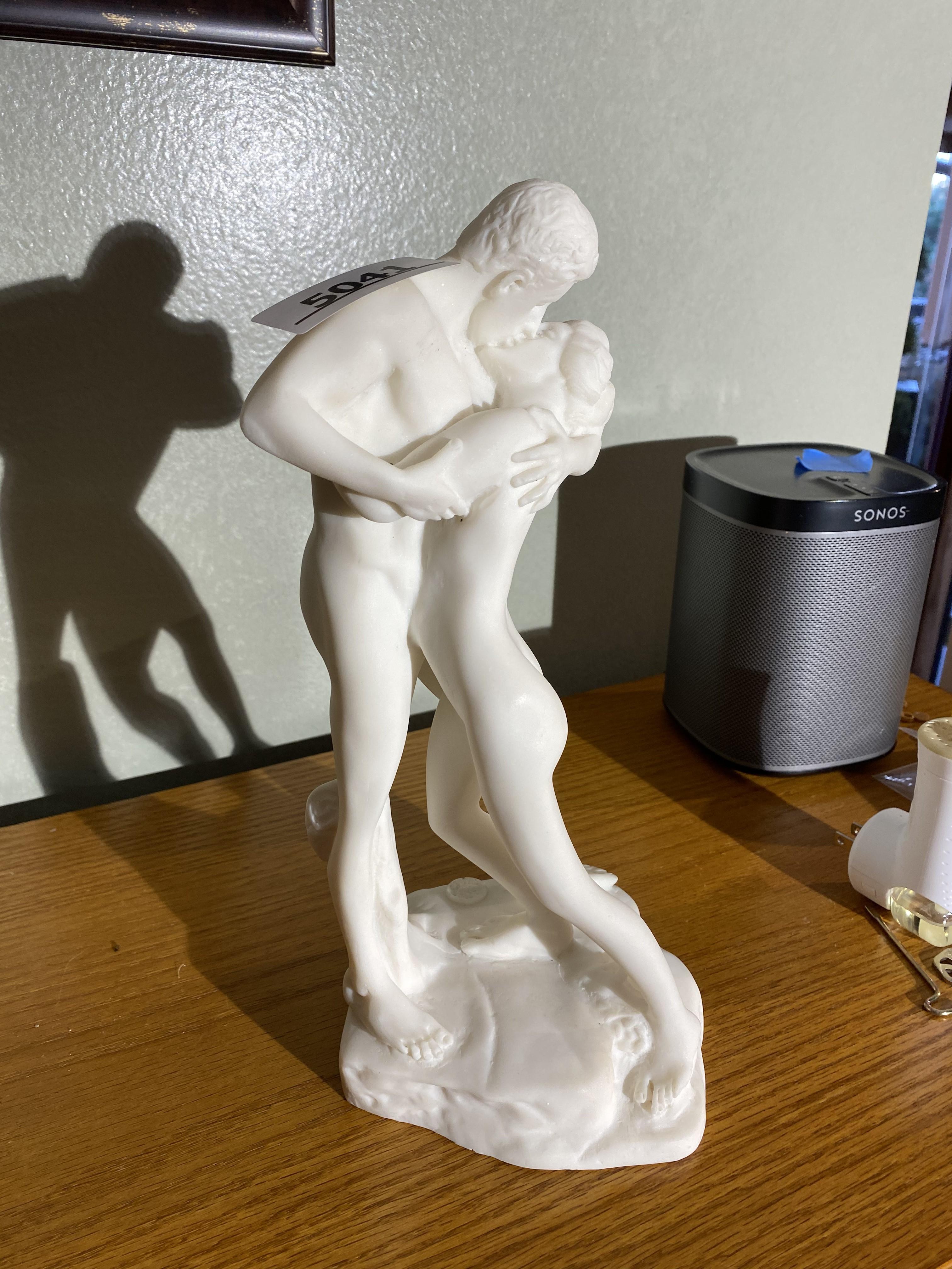 Alabaster sculpture or statue of man and woman kissing