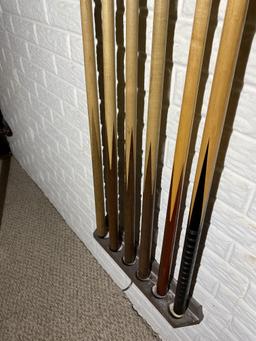 2 racks full of Vintage Pool Cue Sticks