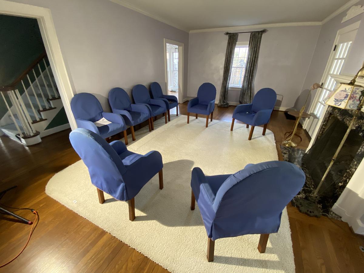 Group of 8 chairs with blue covers