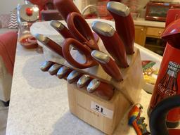 Kitchen knives in block plus red kitchen items