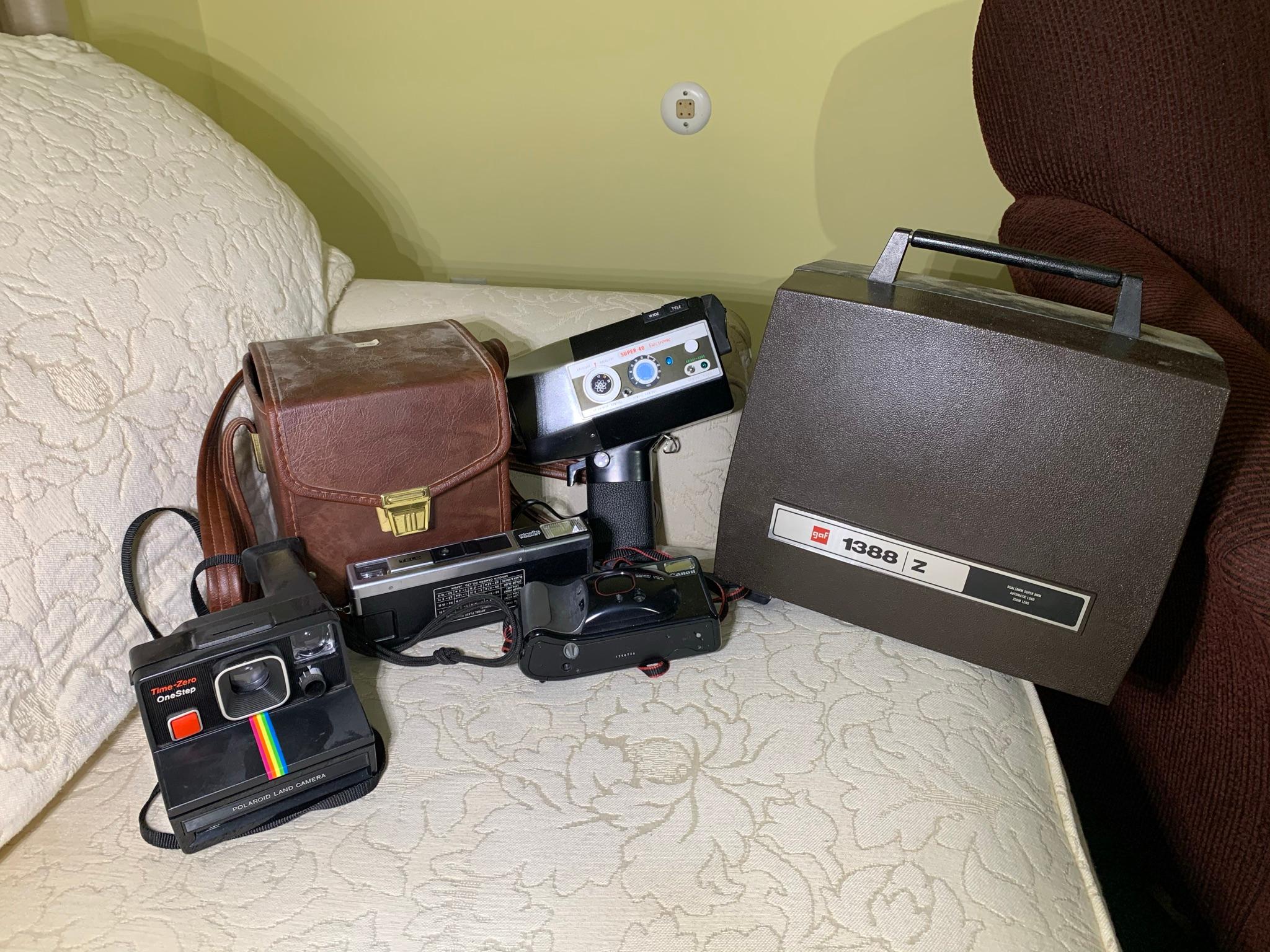 Assortment of Vintage Cameras - Polaroid Land, Canon,  Minolta Pocket & More