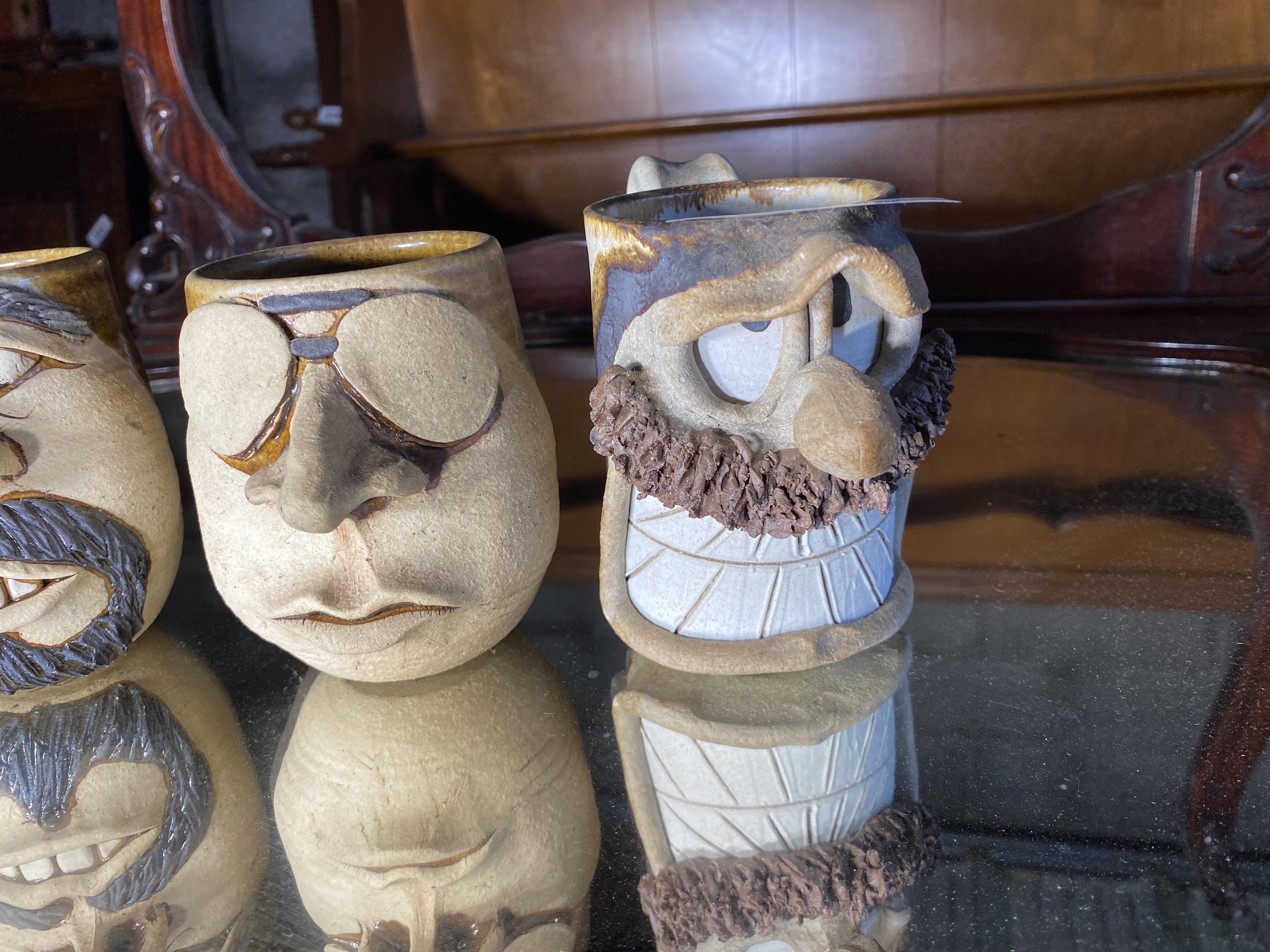 Group lot of four art pottery mugs