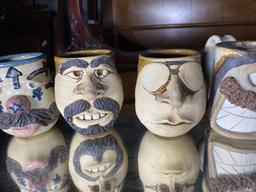 Group lot of four art pottery mugs