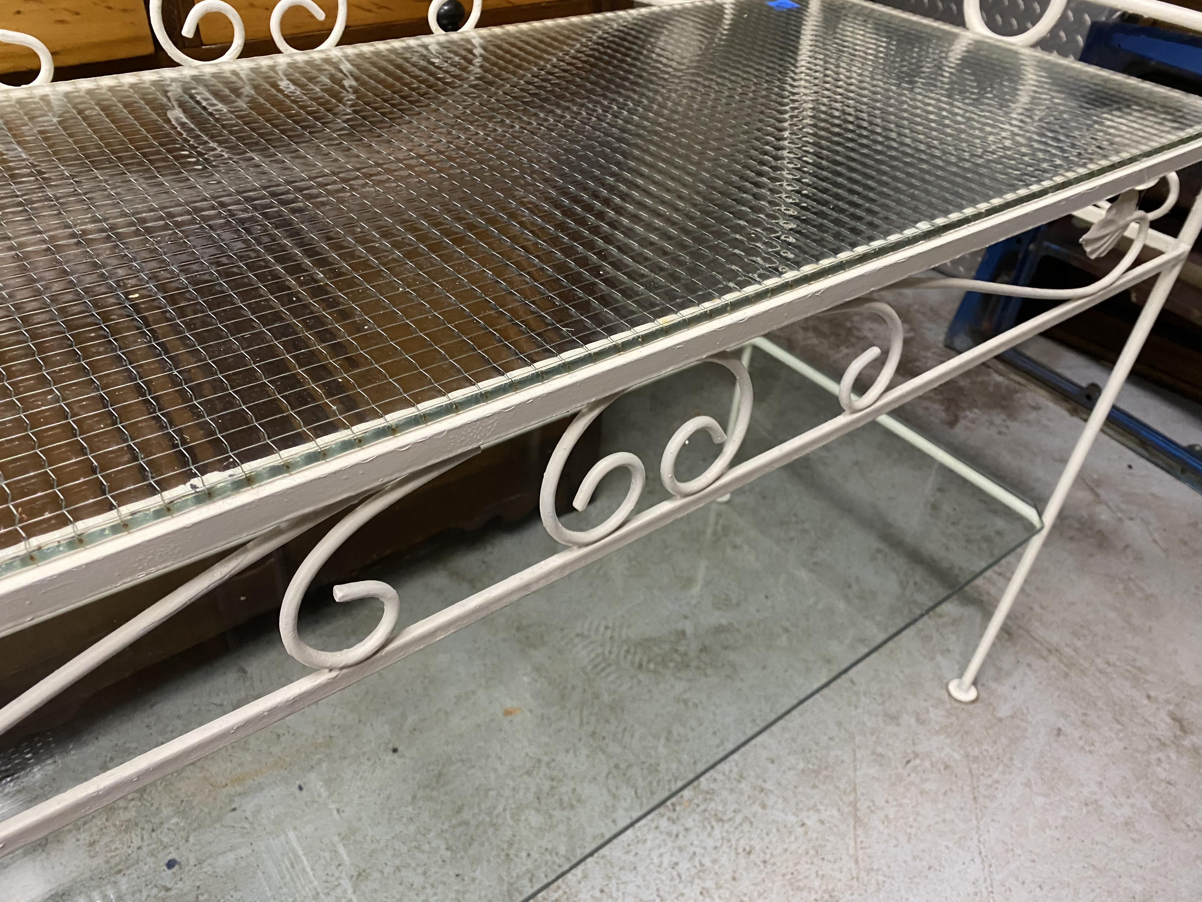 Wrought metal and glass garden table