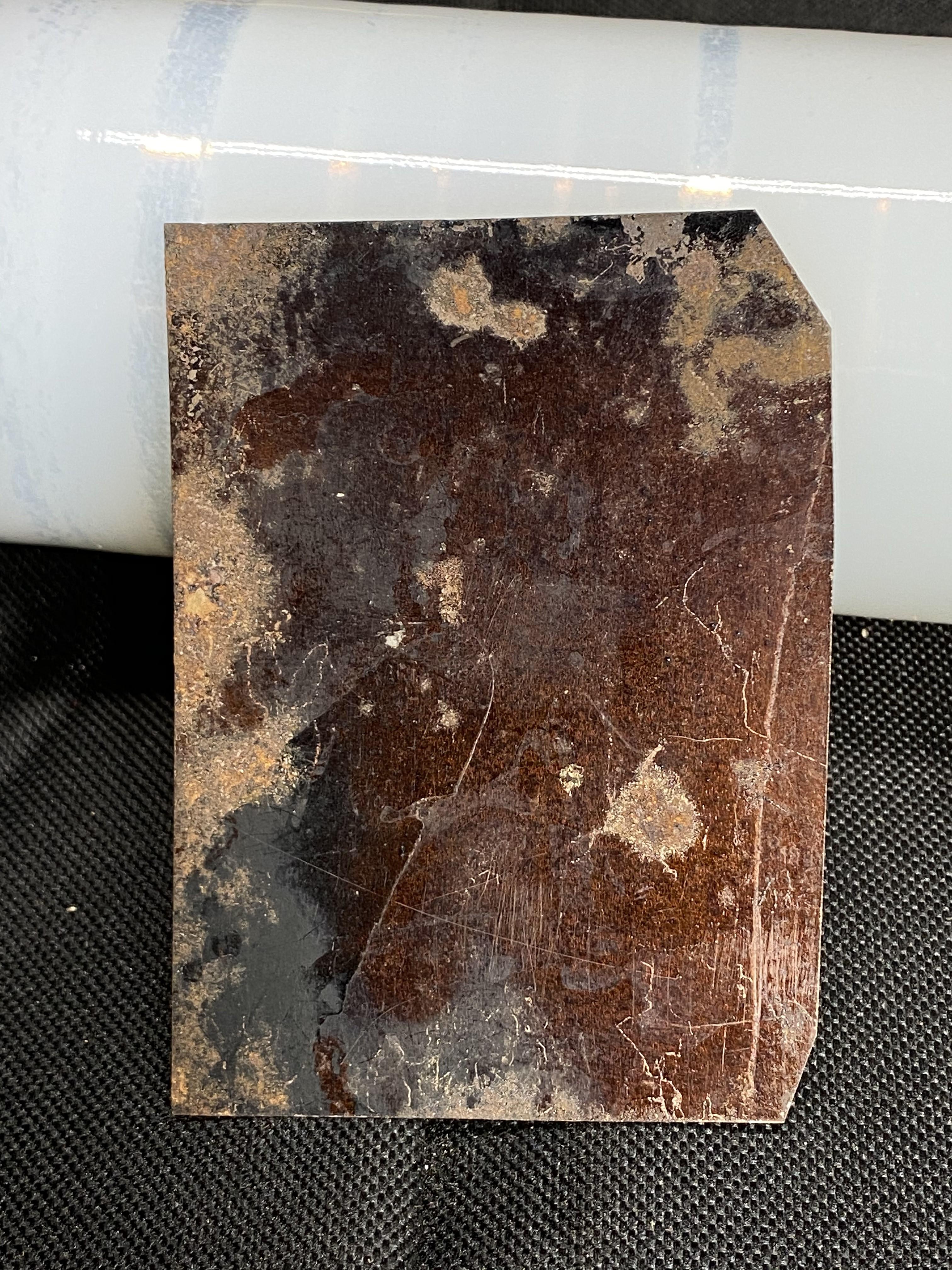 Early tintype of a man with Bicycle