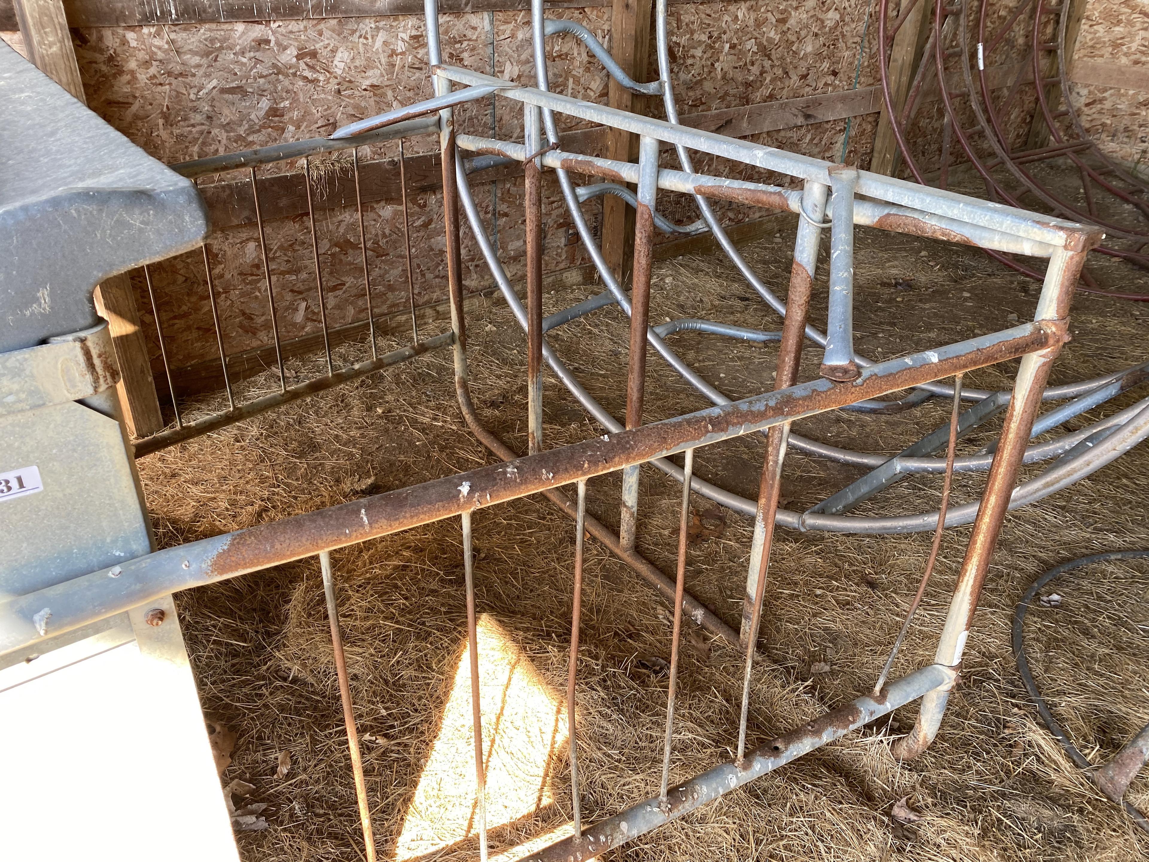 Metal and plastic cattle bale feeder