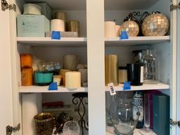 Cupboard lot of candles, lamp oils, vases