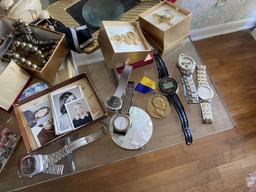 Table lot of watches, jewelry and more