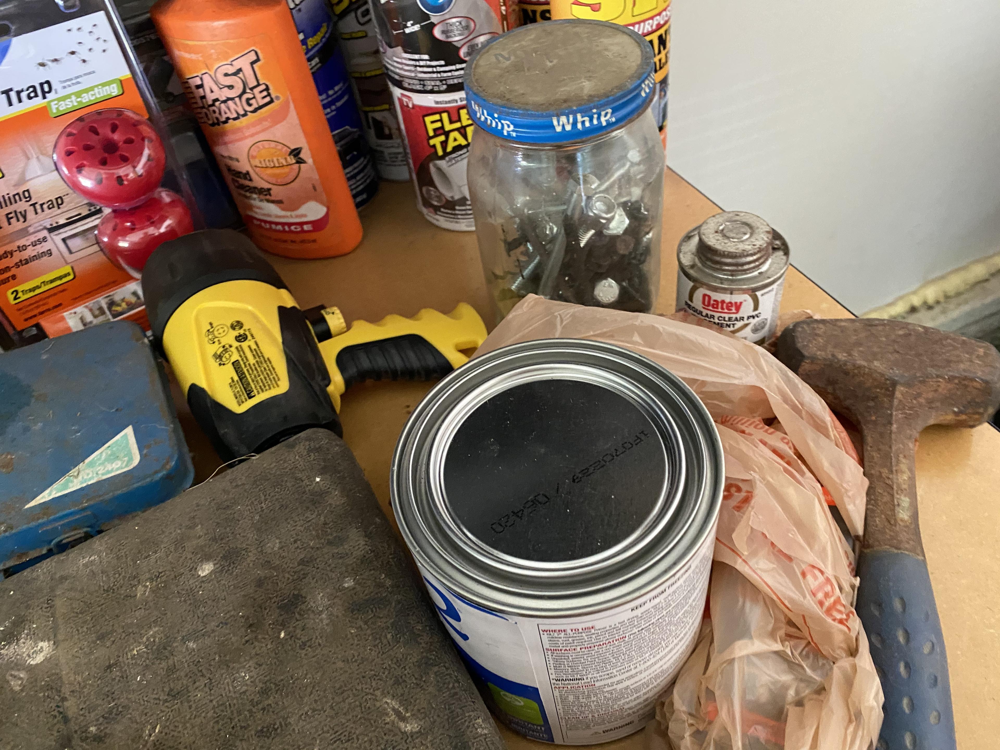 Items on right side of tool bench including anvil, plane in box