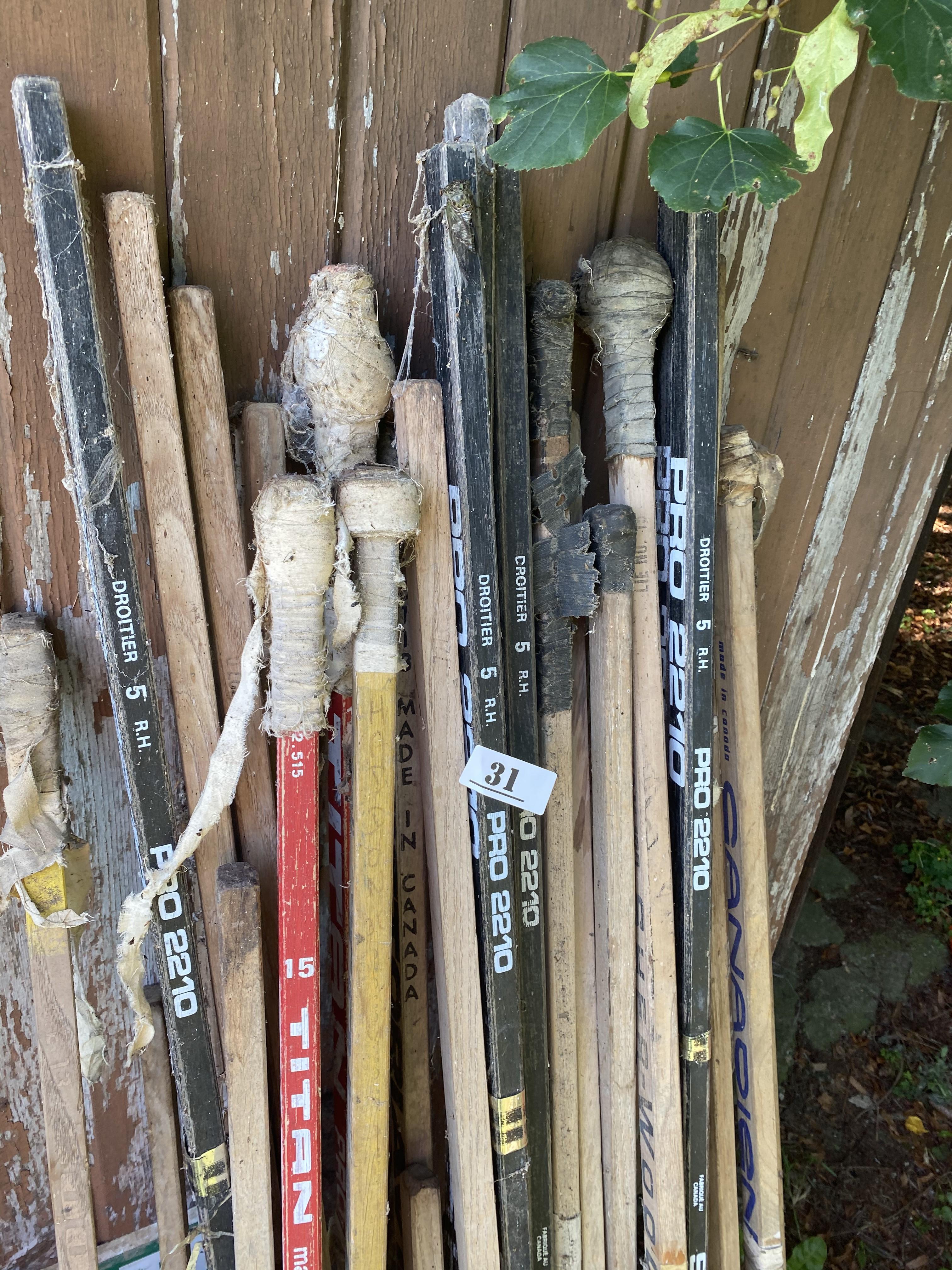 Large lot of vintage Hockey Sticks