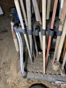 Large number of hand tools on stand