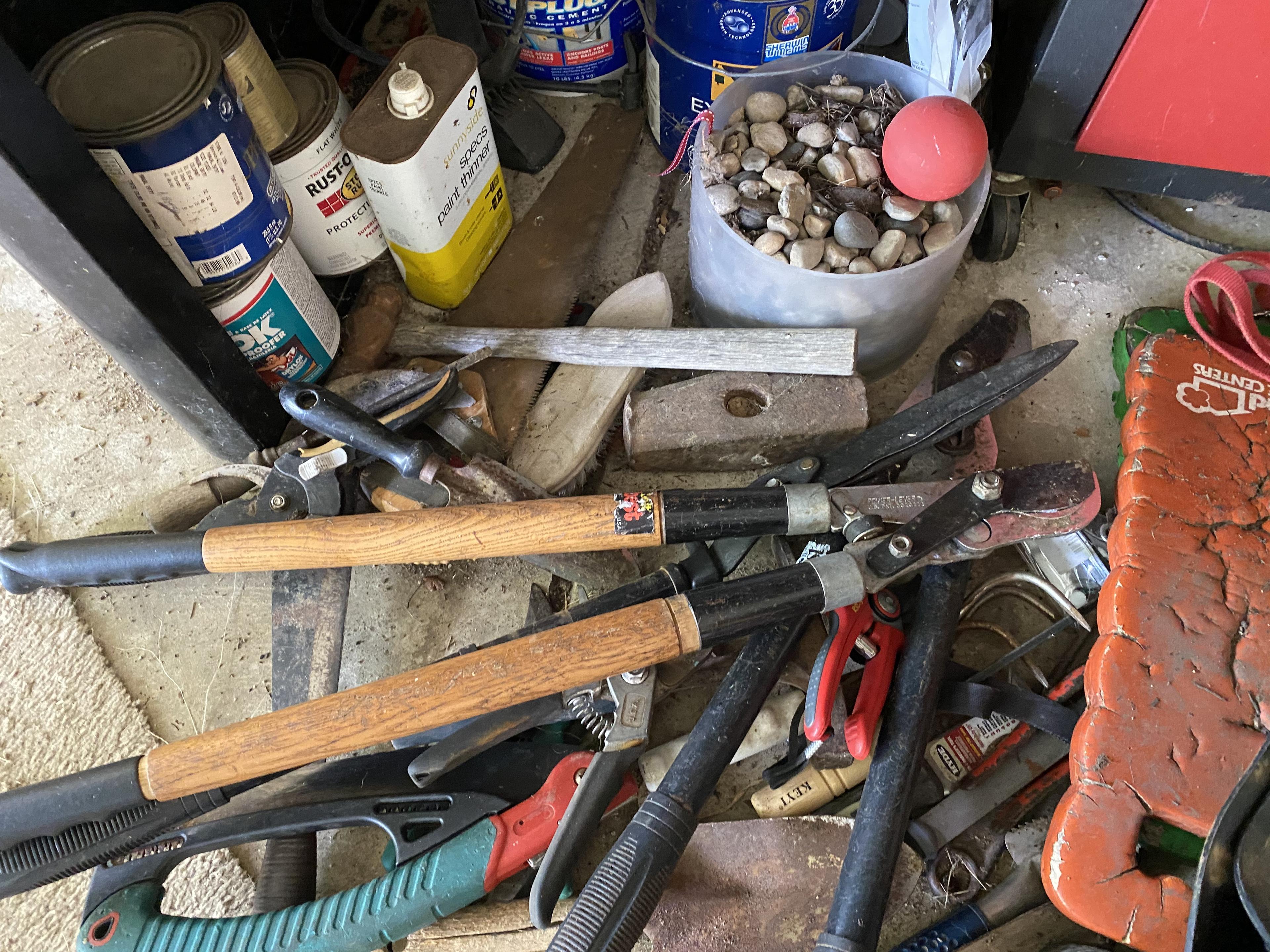 Items under workbench lot including tool boxes