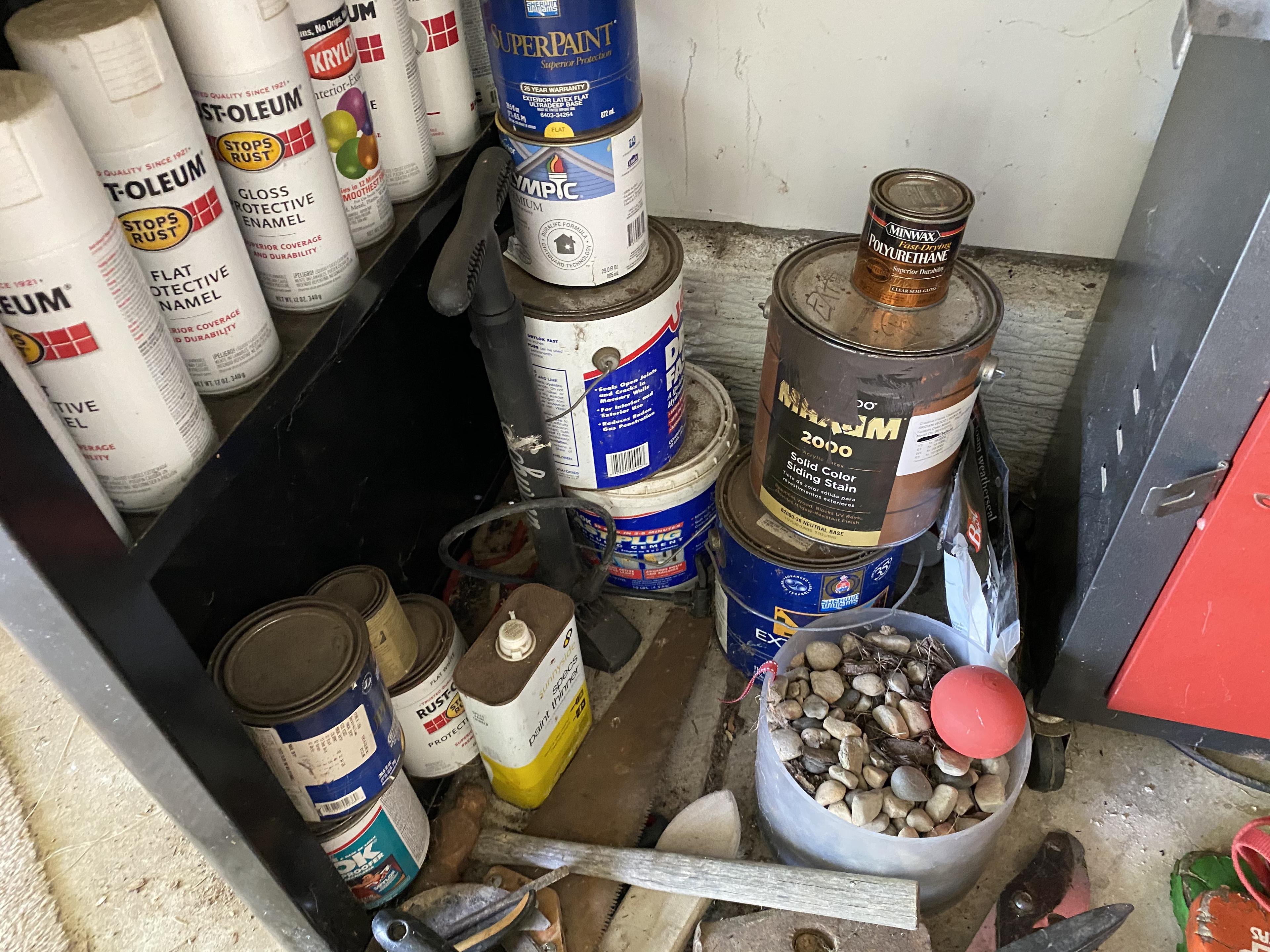 Items under workbench lot including tool boxes