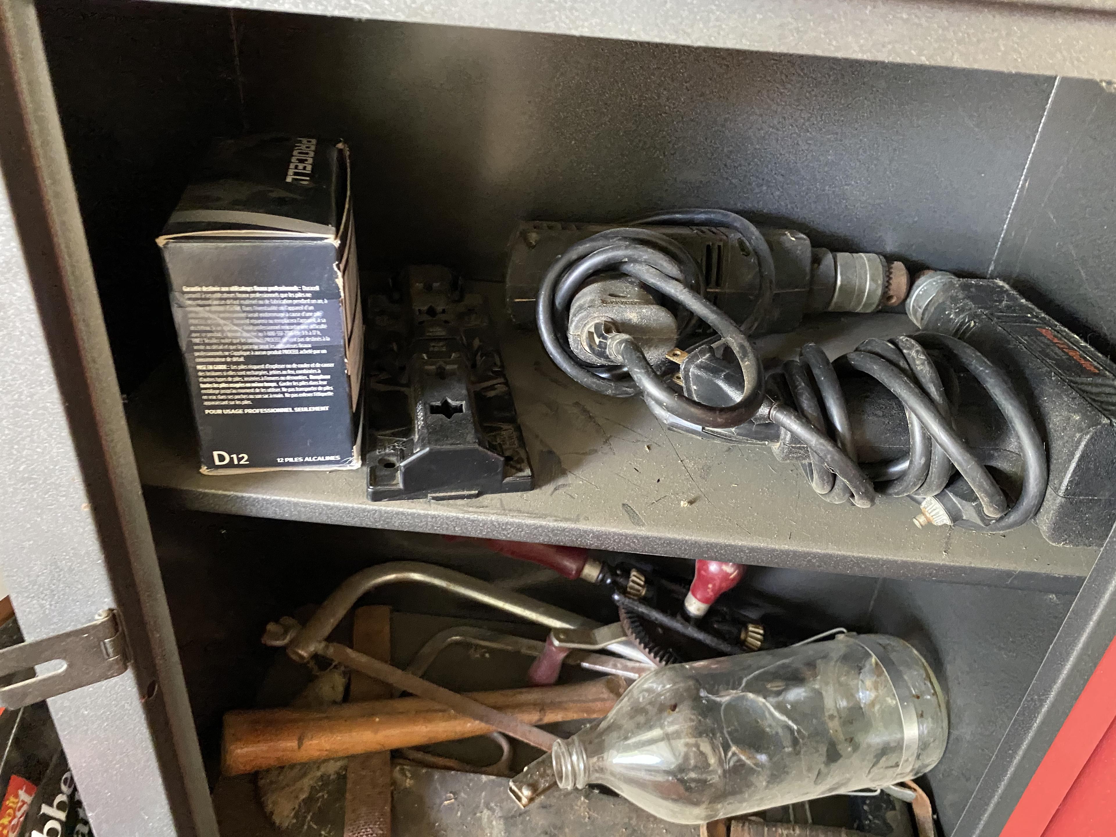 Items under workbench lot including tool boxes