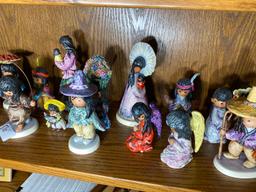 Shelf lot of southwest Native American Hummel Figurines