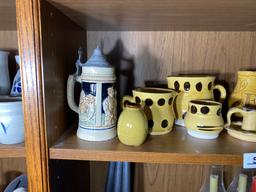 Shelf lot of decorative pottery, steins