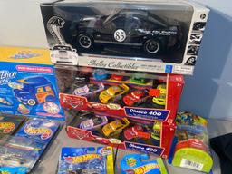 Large Lot of toys in packaging - Includes Hot Wheels Tail Dragger, Rarities