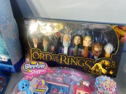 Group lot of assorted toys in packaging including Lord of the Rings