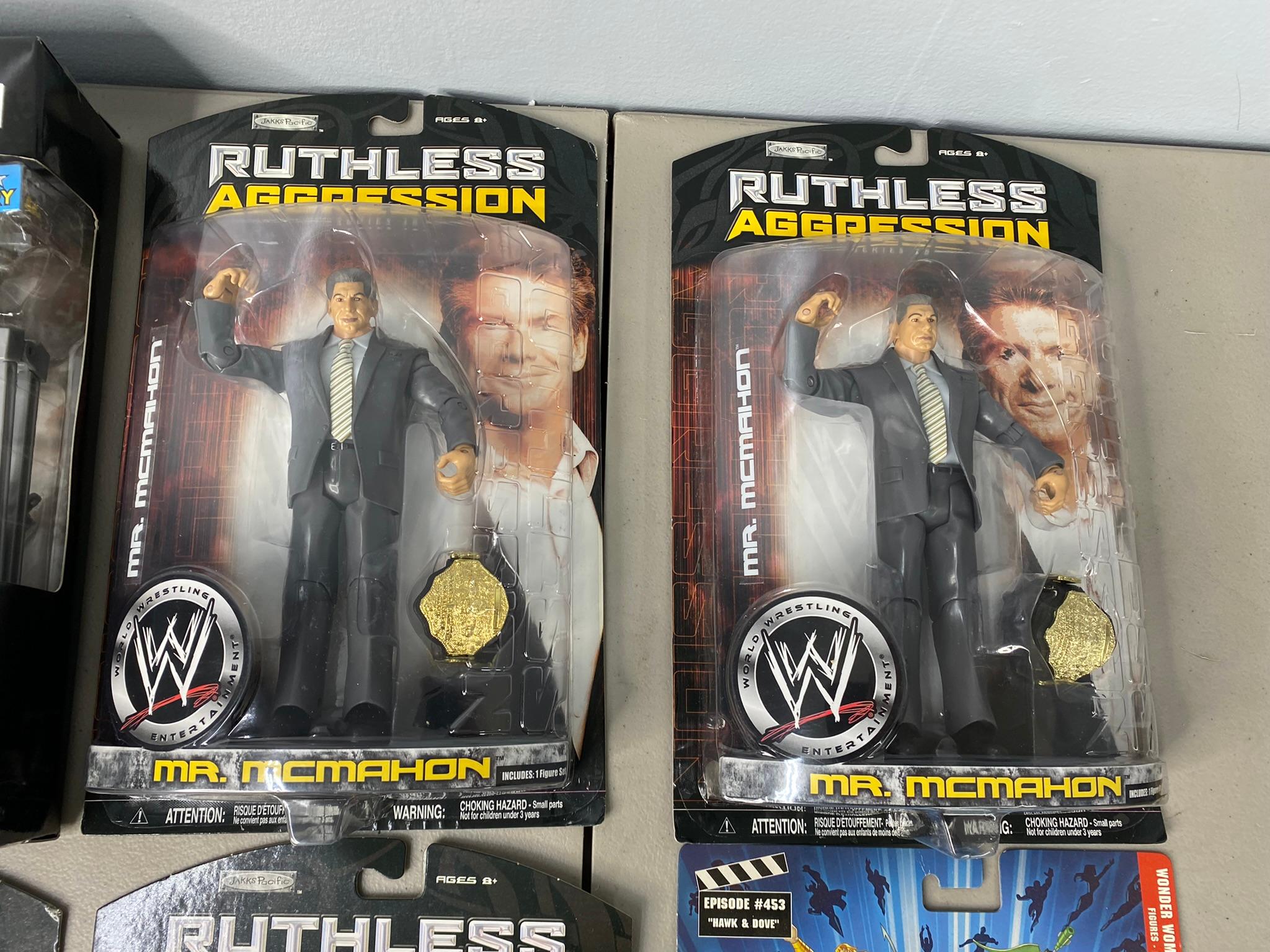 5 WWE Ruthless Aggression Action Figures and Justice League Action Figures New in Box.