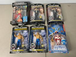 5 WWE Ruthless Aggression Action Figures and Justice League Action Figures New in Box.