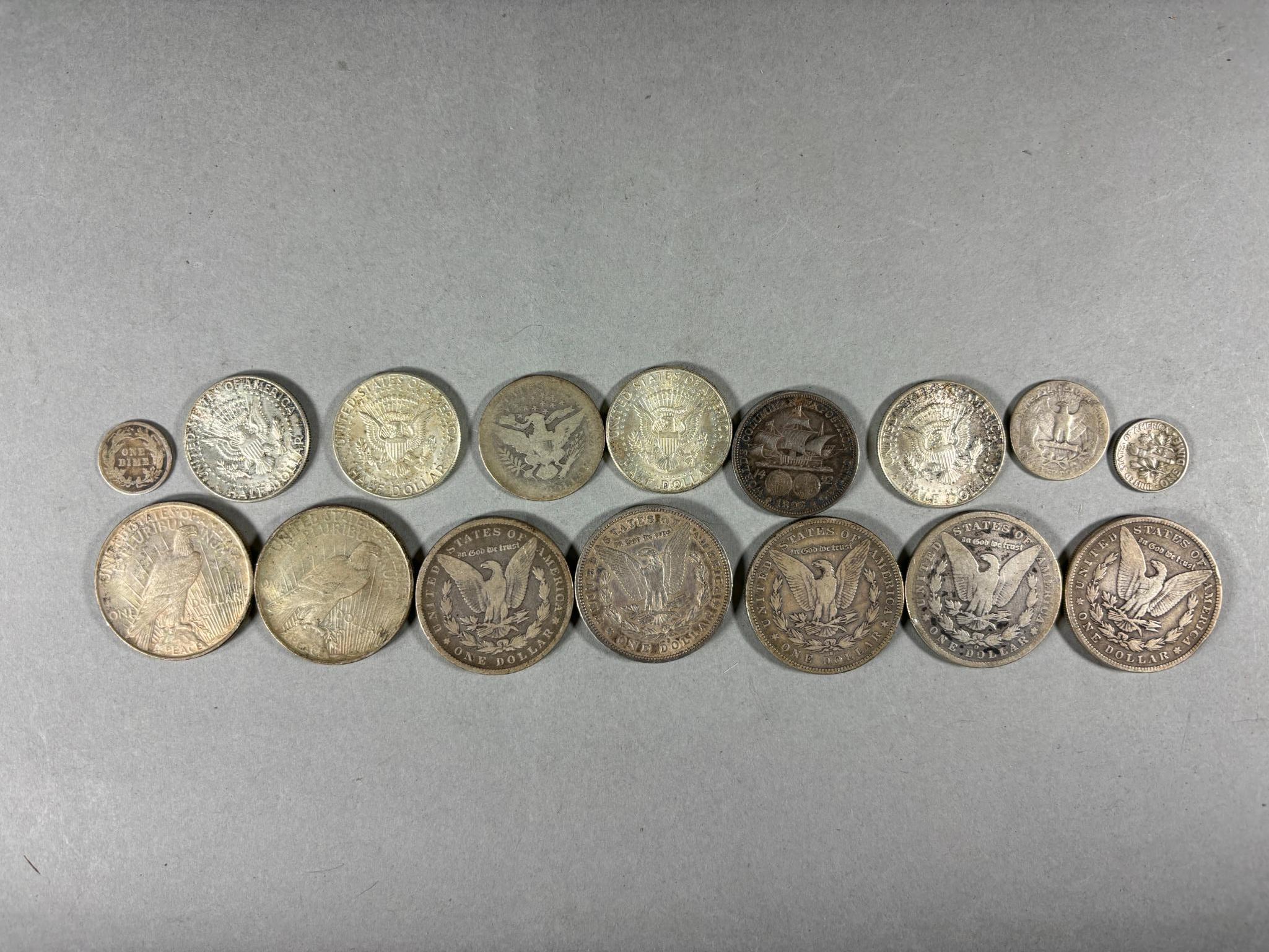 Group Lot of Silver Coins Including Morgan Dollars, Columbian Exhibition, Peace Dollars