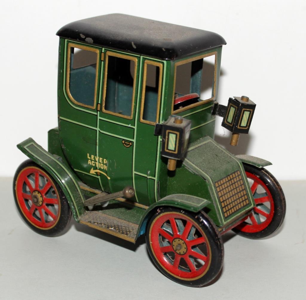 tin litho level action car "TradeMark Modern Toys