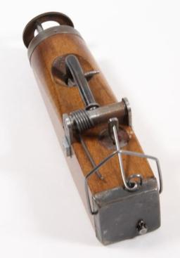 *Mole trap gun. Constructed of wood and metal