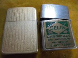 TWO VINTAGE ADVERTISING CIGARETTE LIGHTERS