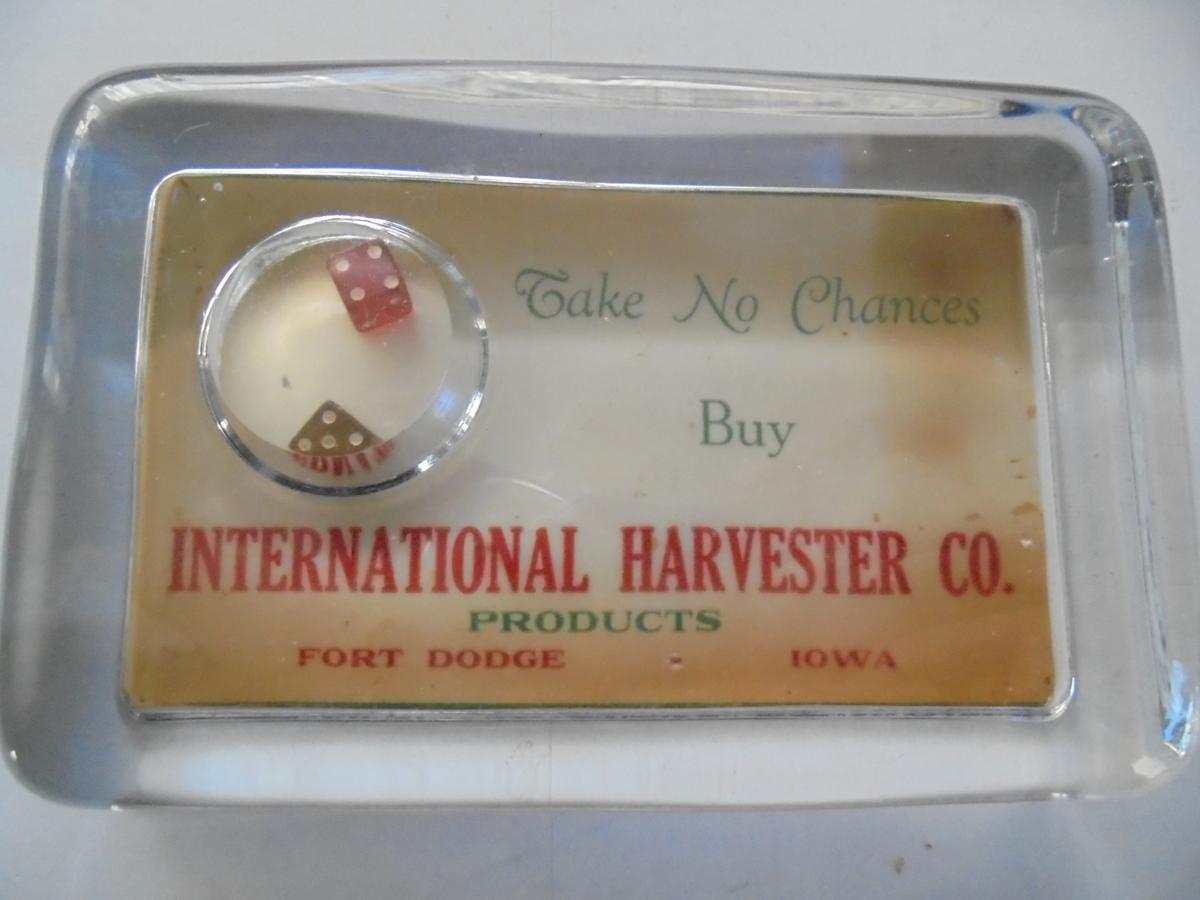 EARLY INTERNATIONAL HARVESTER ADVERTISING PAPER WEIGHT WITH A SMALL PAIR OF DICE-FT. DODGE IOWA