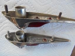 OLD AUTOMOBILE TRIM PIECES WITH RED REFLECTOR AND A MOUNT FOR MAYBE ANTENNA'S ? NOT SURE