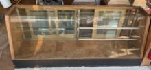 SLANT FRONT GLASS STORE DISPLAY CASE